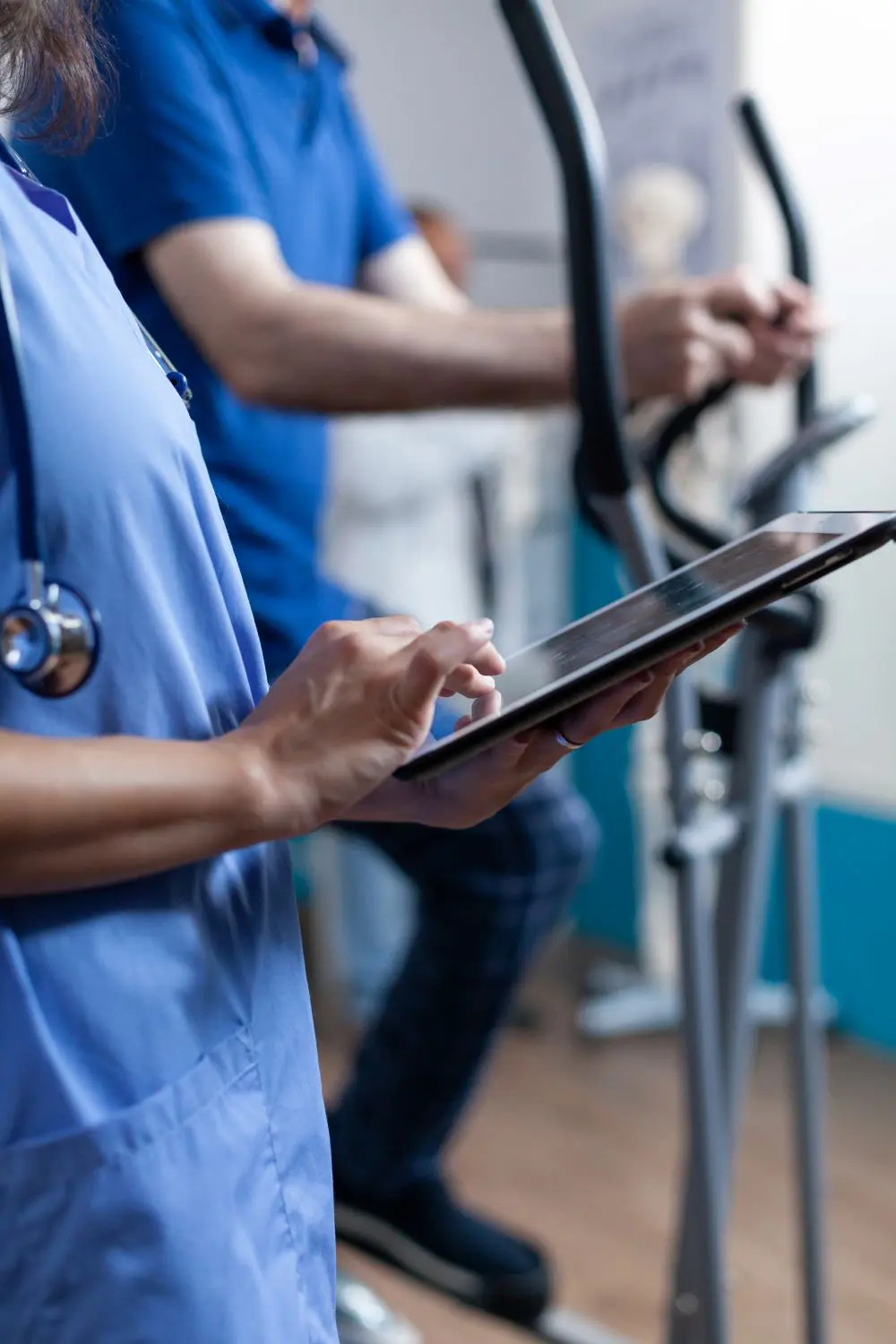 Allied health practitioner at Botanic Ridge Doctors reviewing patient information on a tablet